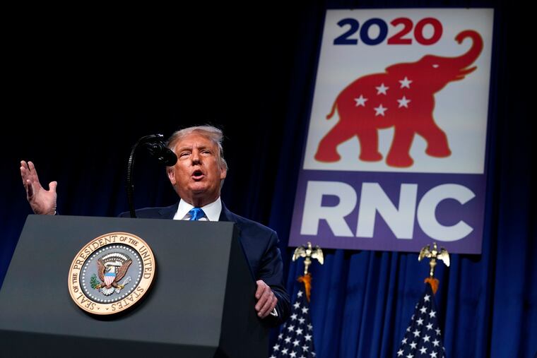 President Donald Trump speaks on stage during the first day of the Republican National Committee convention.