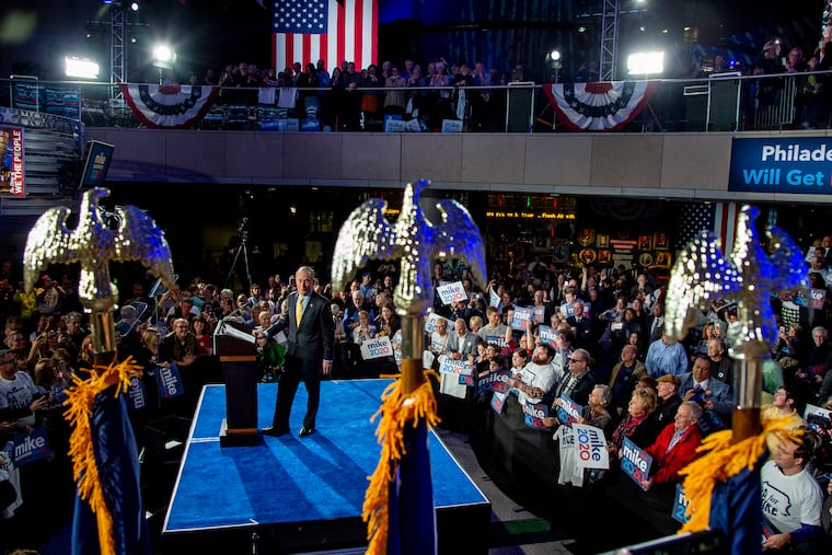 Democratic presidential candidate and former New York City Mayor Michael Bloomberg arrives onstage for a campaign rally at the National Constitution Center in Philadelphia.