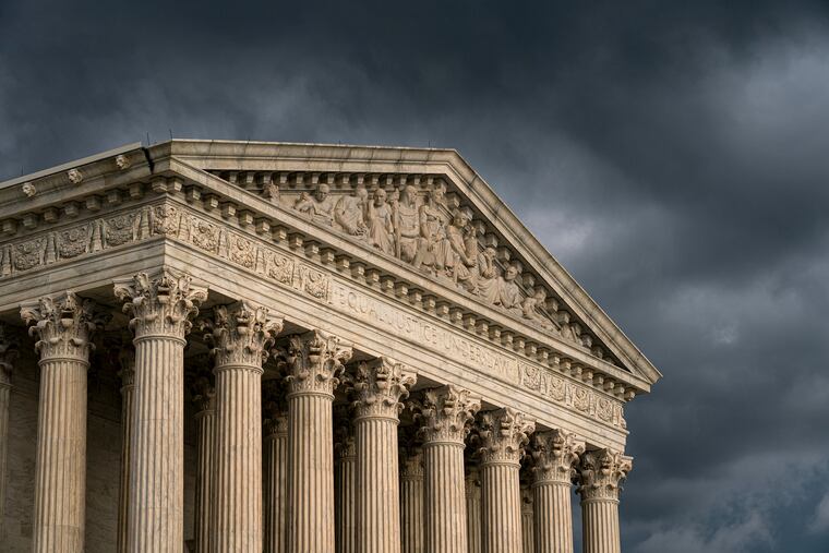In this June 20, 2019 file photo, The Supreme Court is seen under stormy skies in Washington.