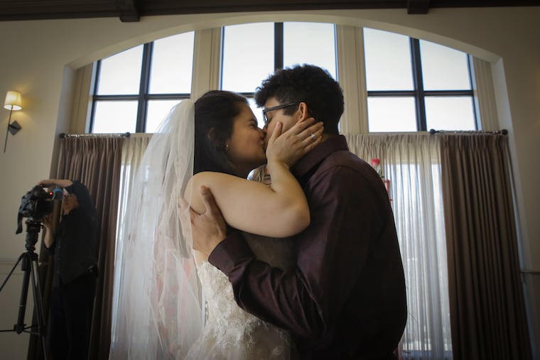 Rachel Dietrich and Ermes Rojas kiss at Salute the Dress wedding for Gold Star family wedding held at Camden County Boathouse, Pennsauken, NJ on Valentines Day, Thursday, February 14, 2019. The grooms uncle Hector Luis Ortiz died while on active duty.