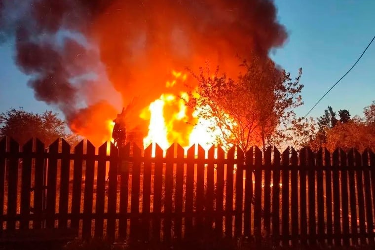 This photo released by Moscow Region Governor Andrei Vorobyev's official telegram channel shows a house on fire after a Ukrainian attack in Khimki, just outside Moscow, Russia, on Sunday, May 17, 2026.