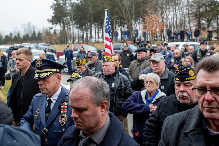 A crowd of people stands at a funeral for Vietnam War Veteran, Peter Turnpu, who was buried with military honors at Brigadier General William C. Doyle Memorial Cemetery in Wrightstown NJ January 18, 2019. Turnpu had no traceable family to host the funeral when he died of natural causes on December 9, 2018.