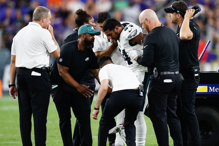 Eagles linebacker Shaun Bradley gets help standing after getting injured during the third quarter in a preseason game against the Baltimore Ravens at M&T Bank Stadium in Baltimore, MD on Saturday, August 12, 2023.