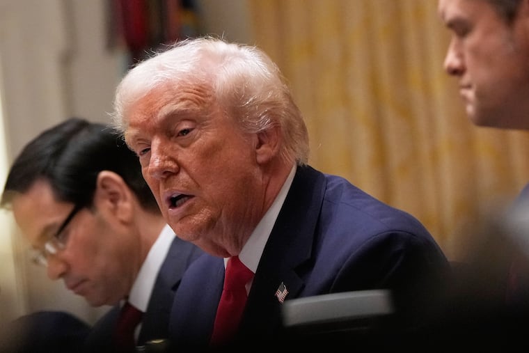 President Donald Trump speaks during Tuesday's cabinet meeting at the White House with Secretary of State Marco Rubio (left) and Defense Secretary Pete Hegseth.
