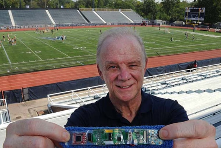 Edmond Dougherty with a prototype of his BandaVida, which athletes wear to monitor the effects of jarring head injuries. He is seeking funding for the device’s latest version on Kickstarter. (CLEM MURRAY/Staff Photographer)