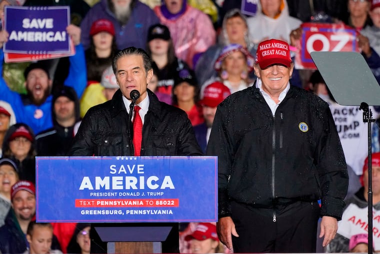 Pennsylvania Republican Senate candidate Mehmet Oz, left, accompanied by former President Donald Trump during a campaign rally Friday in Greensburg.