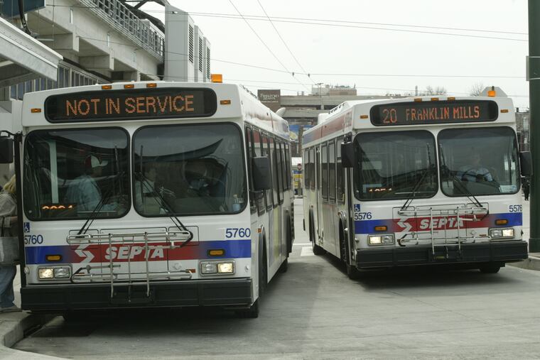 Passengers wait for a SEPTA bus at the Frankford Station on Bridge and Pratt Streets.