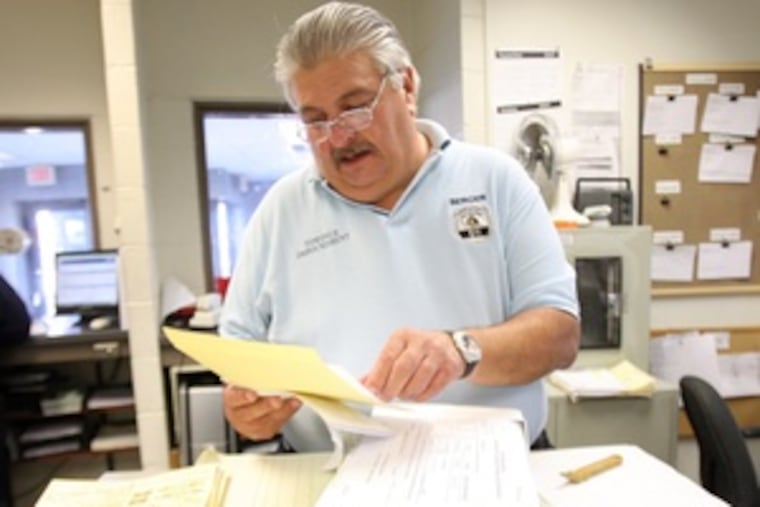 Larry Berger of the impound lot crew. One payoff to the TV series for both agency and employees: "It's good for morale."