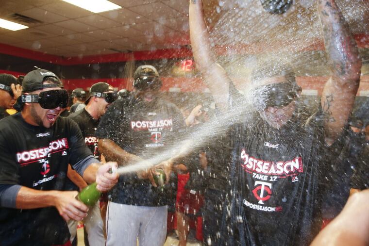 The Minnesota Twins celebrate making the playoff's after a game against the Indians on Thursday.