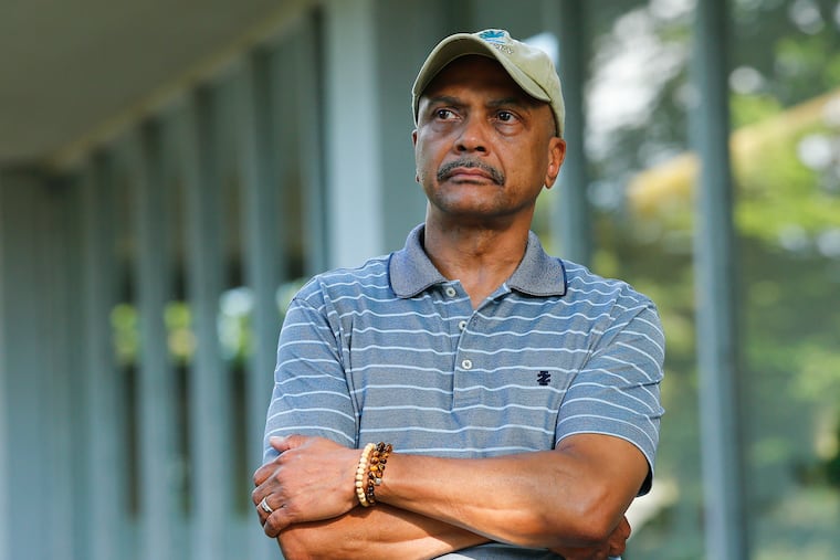 Andrew Washington stands outside his Wynnefield Heights home. He, like so many others, has been struggling financially during the COVID-19 pandemic.