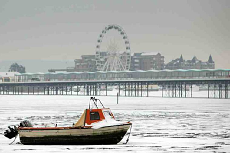 Freshly fallen snow covers the beach in Weston-Super-Mare, England after this week's heavy storms.