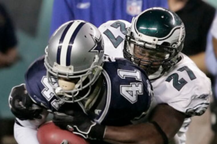 Quintin Mikell , here stopping Dallas' Terance Newman in October, said yesterday: "I'm happy where I am."