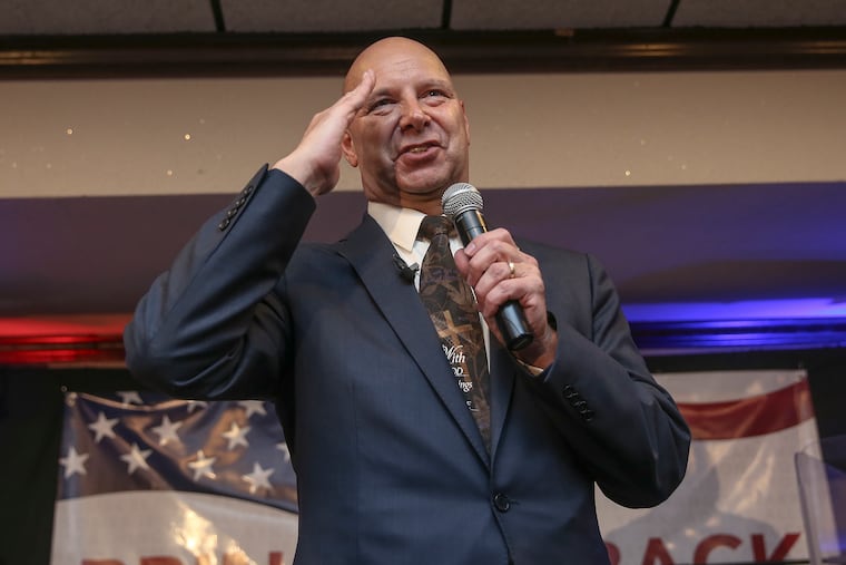 Doug Mastriano salutes as he celebrates winning the GOP nomination for governor in Pennsylvania on Tuesday night.
