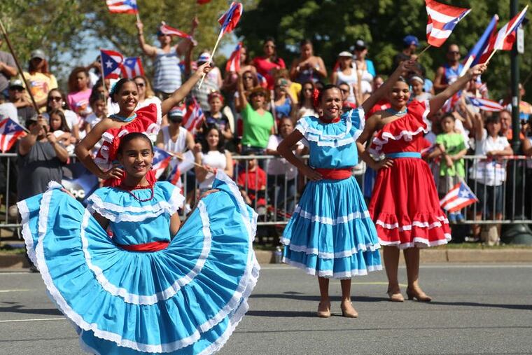 Dancers perform in front of the grandstand at the annual Puerto Rican Day Parade on Benjamin Franklin Parkway.