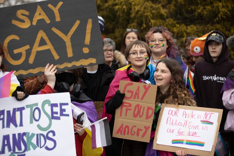 Protests in the Central Bucks School District in the wake of a school board vote banned Pride flags and other "advocacy" materials from classrooms. Teachers, students and parents opposed to the policy say it will impact classroom conversation and have a disproportionate impact on LGBTQ students. Joey Petersen (left) and Wren Curran (right), both students at Lenape Middle School at the rally outside of Central Bucks West High School on Jan 20, 2023.