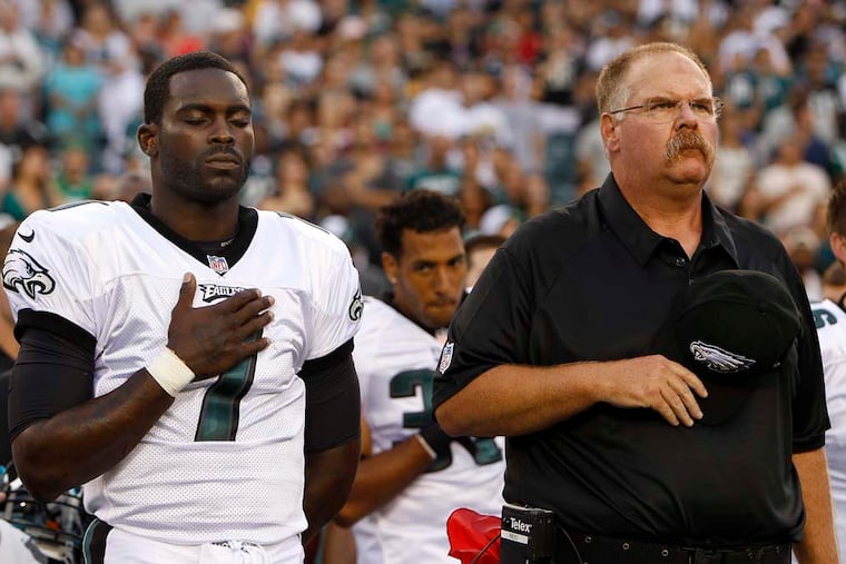 Former Eagles quarterback Michael Vick, left, says he wouldn't be coaching without Andy Reid, right.