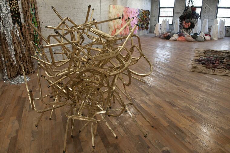 Chair frames from the Revolution Recovery recycling center are twisted into a type of modernist sculpture.