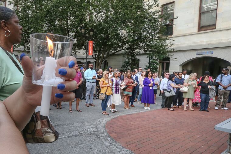City Hall courtyard memorial vigil for Linda Rios-Neuby, the City Council staffer shot dead by her ex-husband in a murder-suicide last week. Thursday, August 23, 2018. STEVEN M. FALK / Staff Photographer