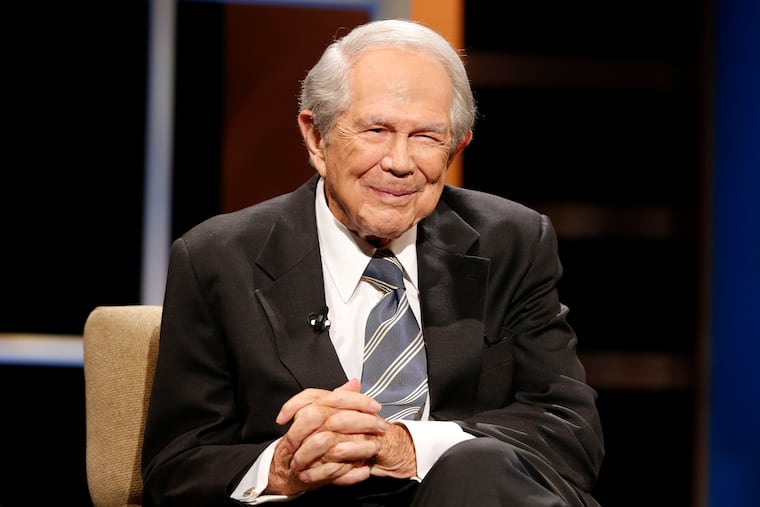Rev. Pat Robertson poses a question to a Republican presidential candidate during a forum at Regent University in Virginia Beach, Va., in 2015.