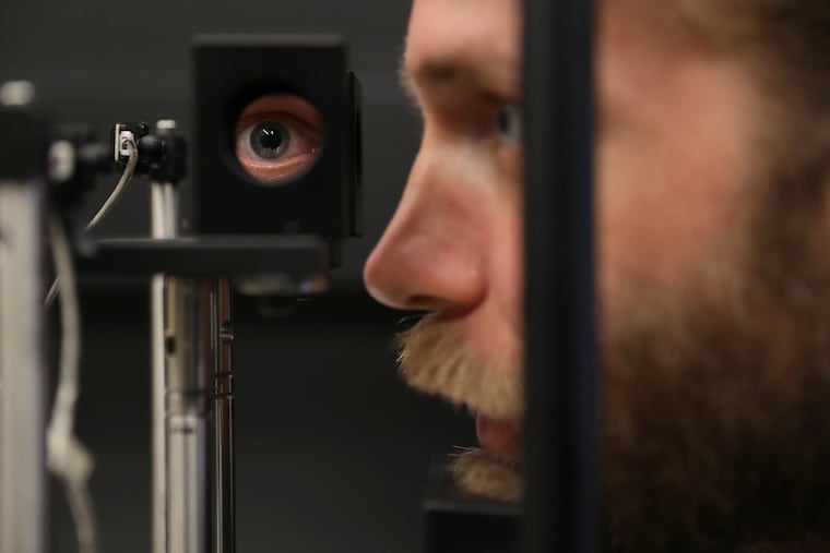 Neuroscientist Johannes Burge demonstrates a haploscope in the Goddard Lab at the University of Pennsylvania in Philadelphia, PA on July 26, 2019.