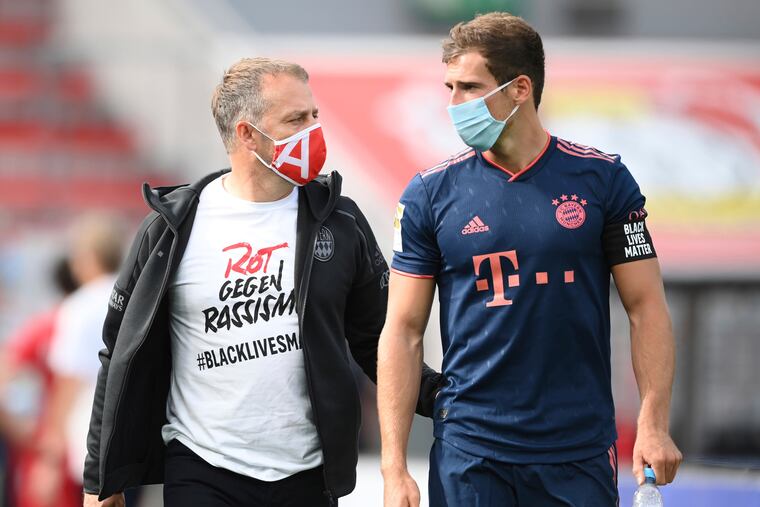 Bayern Munich players and manager Hansi Flick wore t-shirts with the message in German "Red Against Racism #BLACKLIVESMATTER" Saturday. Bayern players wore armbands during the game with "BLACK LIVES MATTER" printed in English.