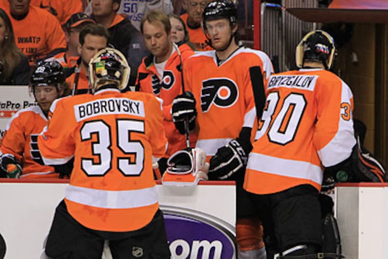 Ilya Bryzgalov (right) and Sergei Bobrovsky each gave up five goals in the Flyers' loss. (Ron Cortes/Staff Photographer)