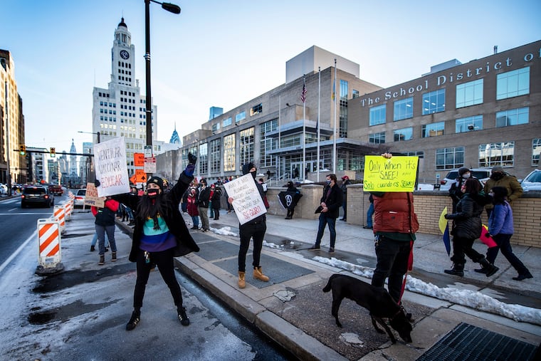 Teachers and supporters gather to protest during a rally outside the Philadelphia School District headquarters in Philadelphia.
