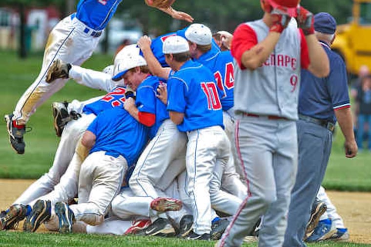 Just can't look: As Washington Township celebrates a 7-4 win in the Group 4 title game, Lenape's Steve Kramitz - who made the final out - pulls his batting helmet down over his eyes.