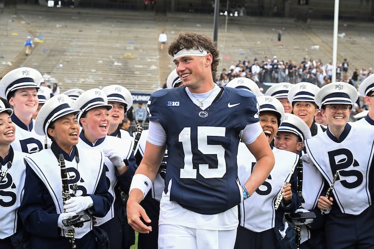Penn State quarterback Drew Allar celebrates with Blue Band members after the Nittany Lions defeated Florida International.