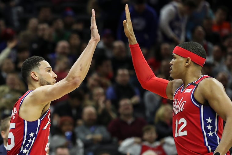 Sixers guard Ben Simmons (25) celebrates with Tobias Harris an and-one call this season.