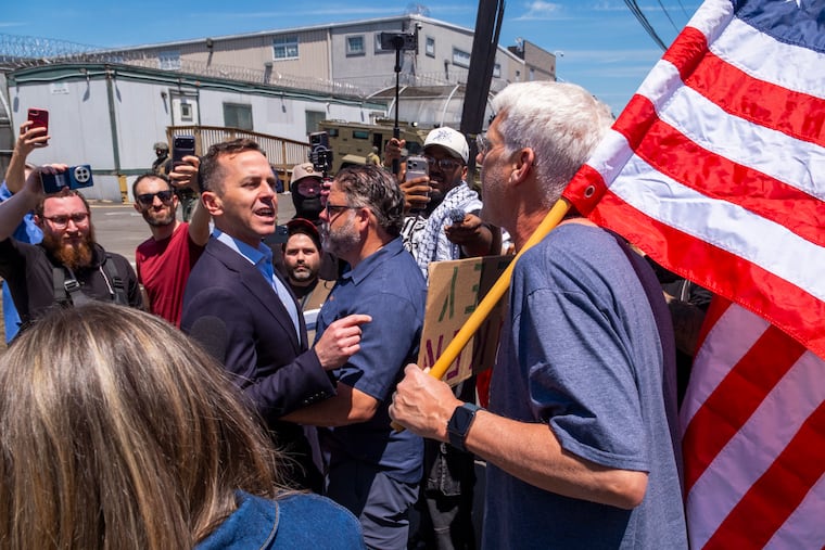 Rep. Robert Menendez Jr. (D-N.J.) argues with a counter-protester carrying an American flag outside Delaney Hall, an immigration detention center in Newark, N.J., on Tuesday, May 26, 2026. A tense standoff erupted on Monday between Immigration and Customs Enforcement agents and protesters who blocked an entrance; the agents responded by firing pepper balls and spray at the protesters.