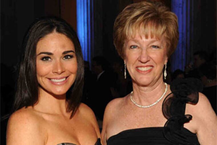 Denise Conway Crawford (right), a player on the Mighty Macs championship teams, and actress Kim Blair, who portrays a player in the film. (Photo / Bob Williams)