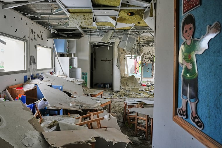 Israeli authorities said five people were injured when a kindergarten was hit by fragments of an Iranian missile in Rishon LeZion, Israel, Saturday, March 21, 2026.