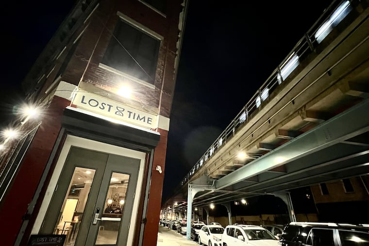 The Market-Frankford El roars overhead in front of Lost Time Brewing Co. in Kensington on Jan. 8, 2024.