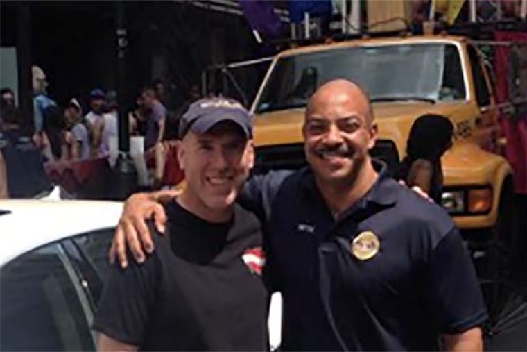 Michael Weiss (left) and Philadelphia District Attorney Seth Williams, outside the Gayborhood landmark Weiss owns, Woody's Bar, at the start of the city's 2015 Gay Pride day.