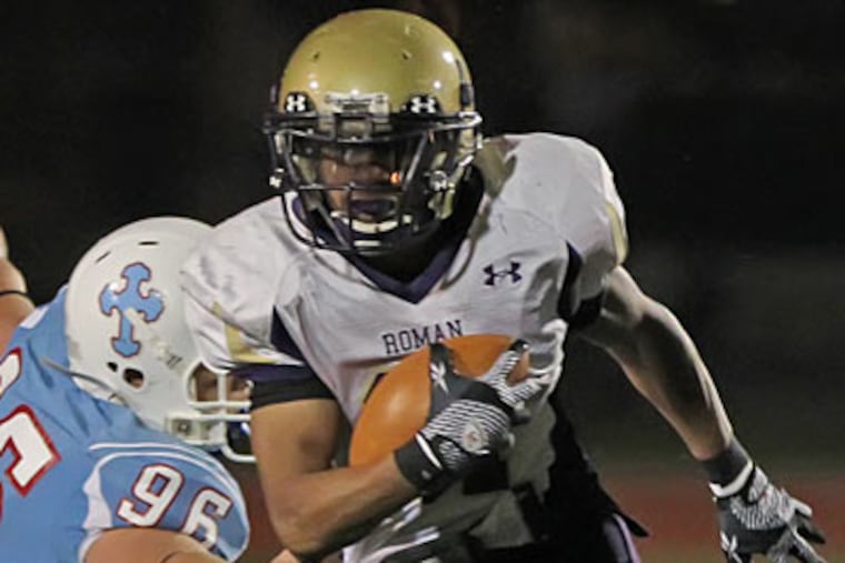 Roman Catholic's Marcus Kelly broke through Father Judge's defense to score a key 87-yard touchdown. (Michael Bryant/Staff Photographer)