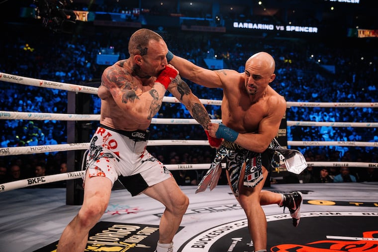 Johnny Garbarino hitting his opponent Apostle Spencer with an overhand right at the Wells Fargo Center during BKFC's KnuckleMania V event.