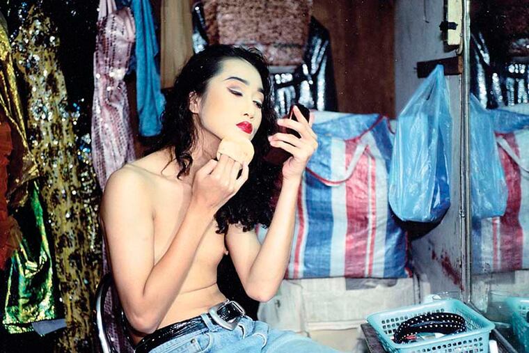 Nan Goldin's photograph, "Yogo Putting on Powder, Second Trip, Bangkok" (1992), at Haverford College's Atrium Gallery