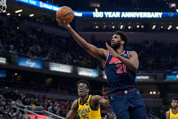 Philadelphia 76ers' Joel Embiid shoots against Indiana Pacers' Jalen Smith during the first half of an NBA basketball game Tuesday, April 5, 2022, in Indianapolis. (AP Photo/Darron Cummings)