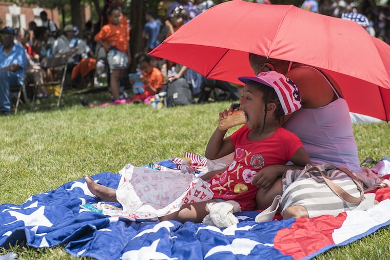 Serenity Jones, 7, enjoys her free hoagie at Wawa's Hoagie Day at Independence Mall on Thursday, June 28, 2018. The free sandwiches are an annual citywide celebration leading up to the fourth of July.