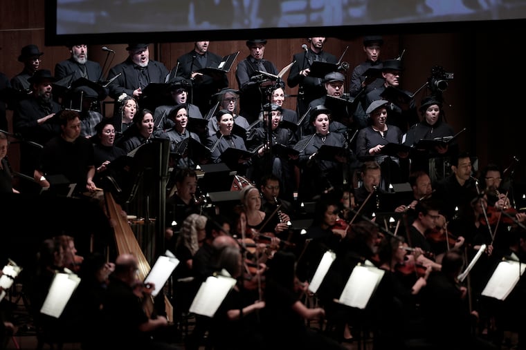 The Crossing (in rear) choir performing with the Philadelphia Orchestra on Wednesday.