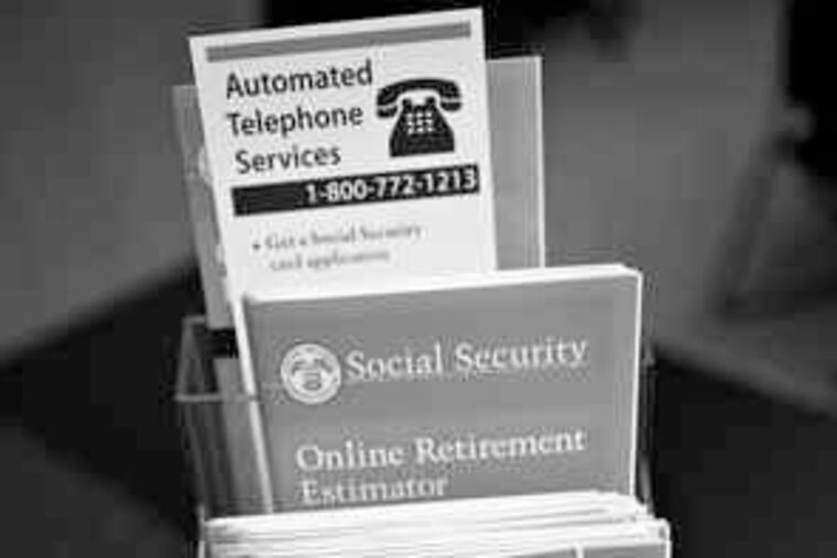 Information brochures on Social Security fill a rack at the opening last month of "Financial Literacy Central" at a New York public library branch.
