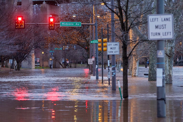 The Schuylkill River floods onto Kelly Drive at Midvale Avenue on Wednesday. Get ready for a sequel.
