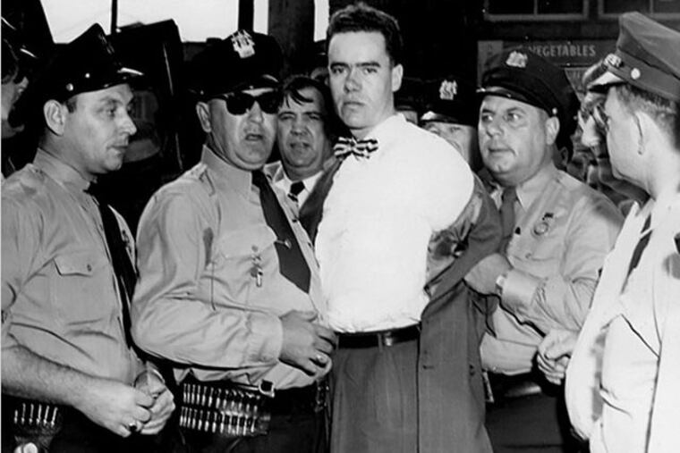 Howard Unruh is taken into custody after killing 13 and wounding 3 in Camden on Sept. 6, 1949.