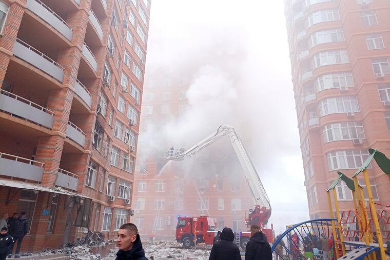 Firefighters work to extinguish a fire at a damaged apartment building after a Russian attack in Odesa, Ukraine.