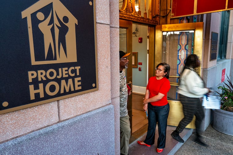 By redirecting funding away from Housing First programs, the president’s order threatens the fragile progress that dozens of cities have made toward ending homelessness, writes Project HOME's Candice Player. In the photo, the nonprofit's CEO Donna Bullock talks with Stanley Shelton (left), a resident since 2010, on Monday, Nov. 11, 2024.