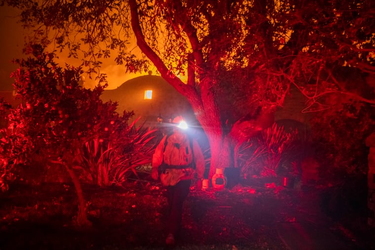Firefighters work at the burning Soda Rock Winery in Healdsburg, California, Sunday, Oct. 27, 2019, as the Kincade fire burned through it. MUST CREDIT: Photo for The Washington Post by Stuart W. Palley.