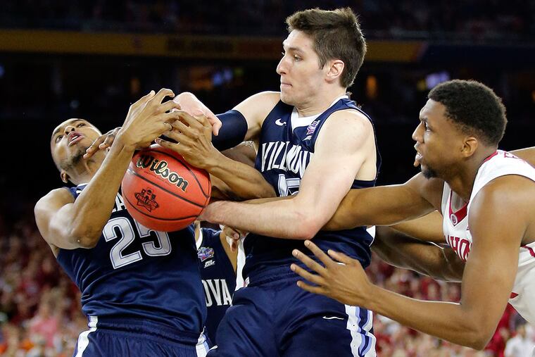 Villanova's Mikal Bridges and Ryan Arcidiacono go after the basketball against Oklahoma's Dante Buford during the first half in the Final Four at NRG Stadium in Houston on Saturday, April 2, 2016.