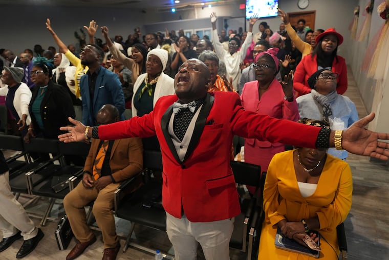 Jean-Michel Gisnel cries out while praying with other congregants at the First Haitian Evangelical Church in Springfield, Ohio on Jan. 26.