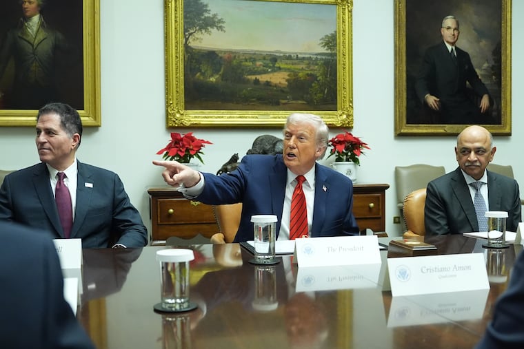 Flanked by founder and CEO of Dell, Michael Dell (left) and Arvind Krishna CEO of IBM, President Donald Trump speaks during a roundtable in the Roosevelt Room of the White House on Wednesday.